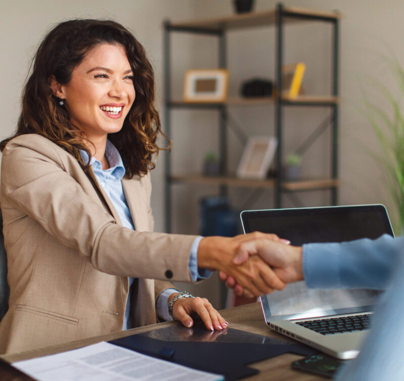 Young woman signing contracts and handshake with a manager Redefine Your Financial
